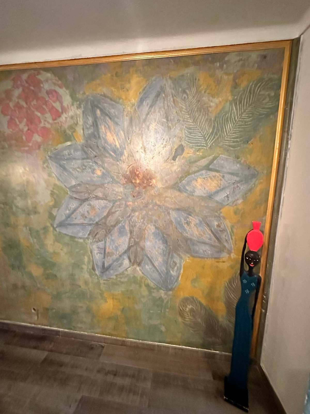 Hand-painted floral ceiling art in blue and gold