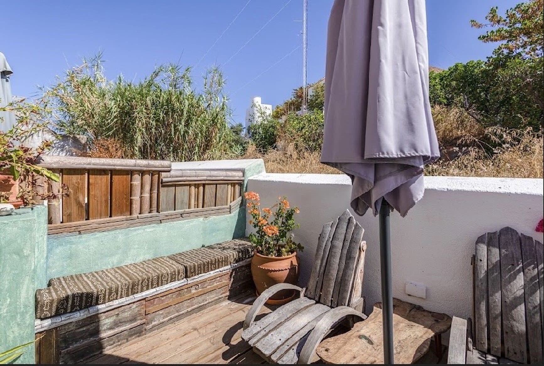 Back terrace with sun lounger and open views